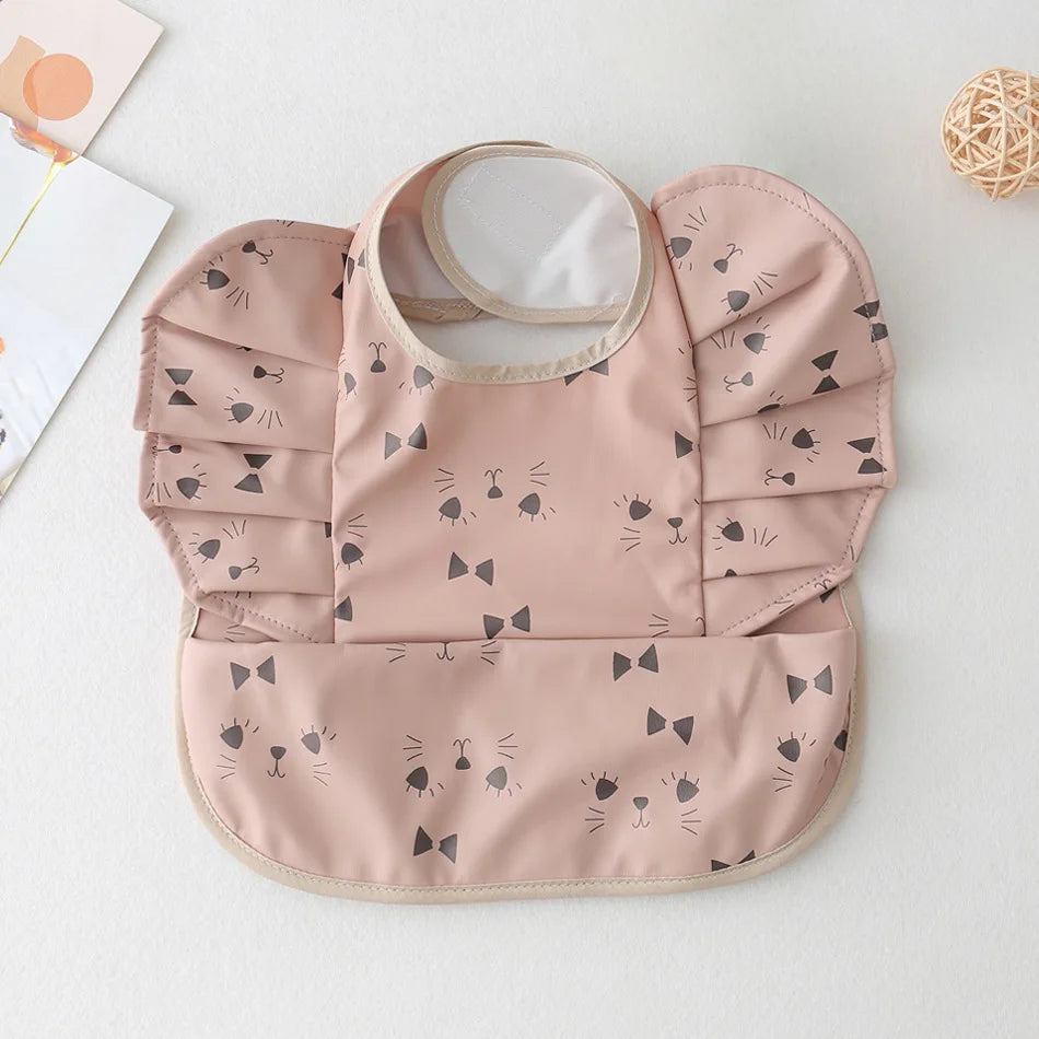 Bavoir bébé imperméable manches courtes à poche - Kassie